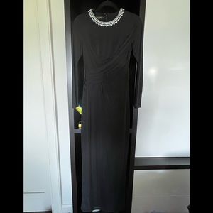 Nothing but class, black long sleeve dress with gem detailing on the neckline.